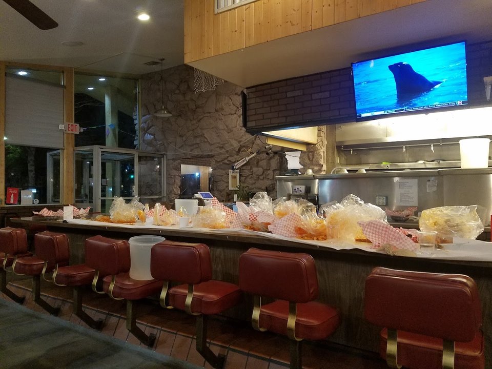 Steaming crab legs served in metal trays