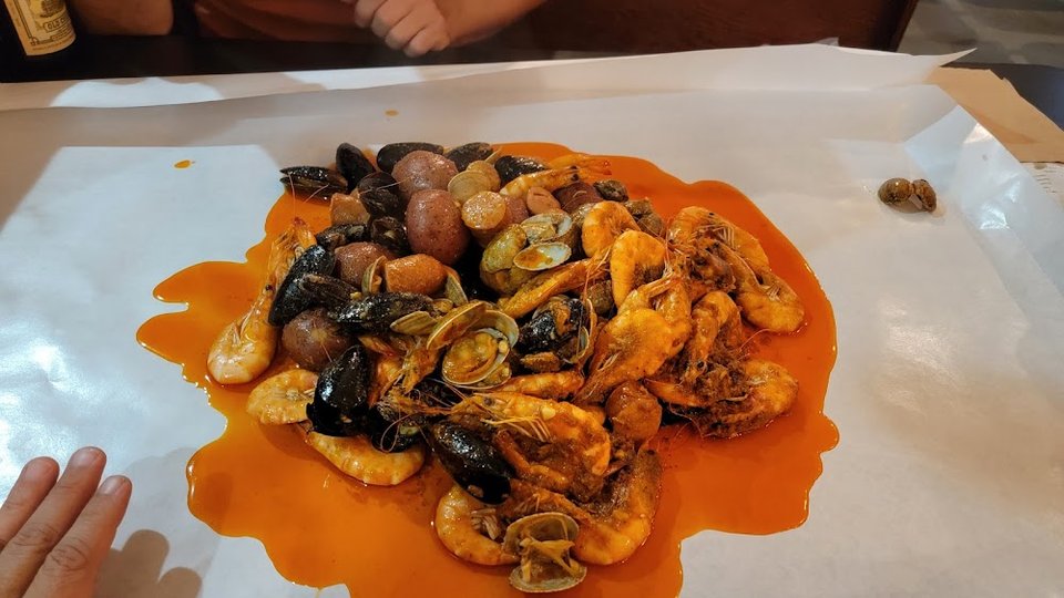 Close-up of seafood boil menu items