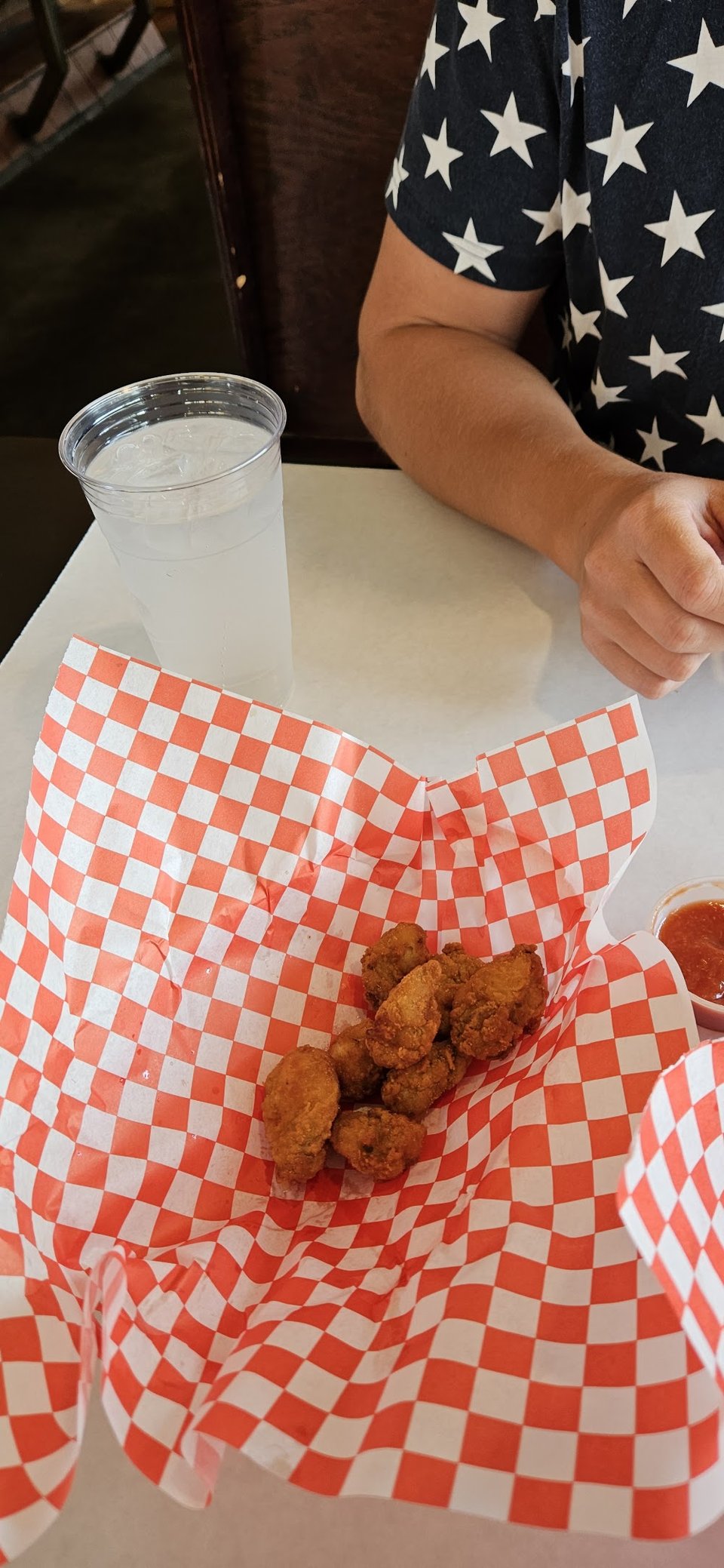 Restaurant menu with wings, rice, and corn