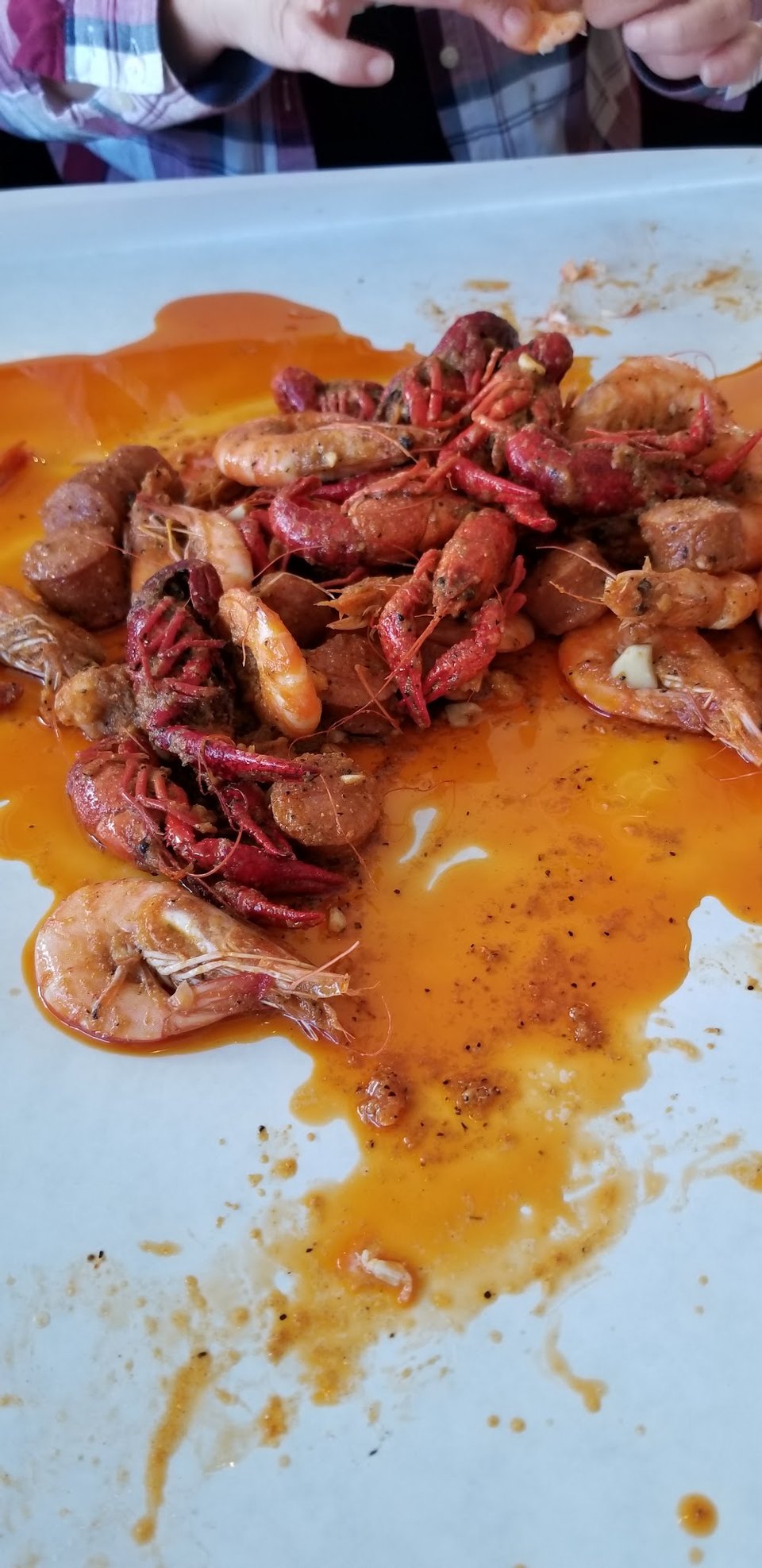 Close-up of seafood boil menu items