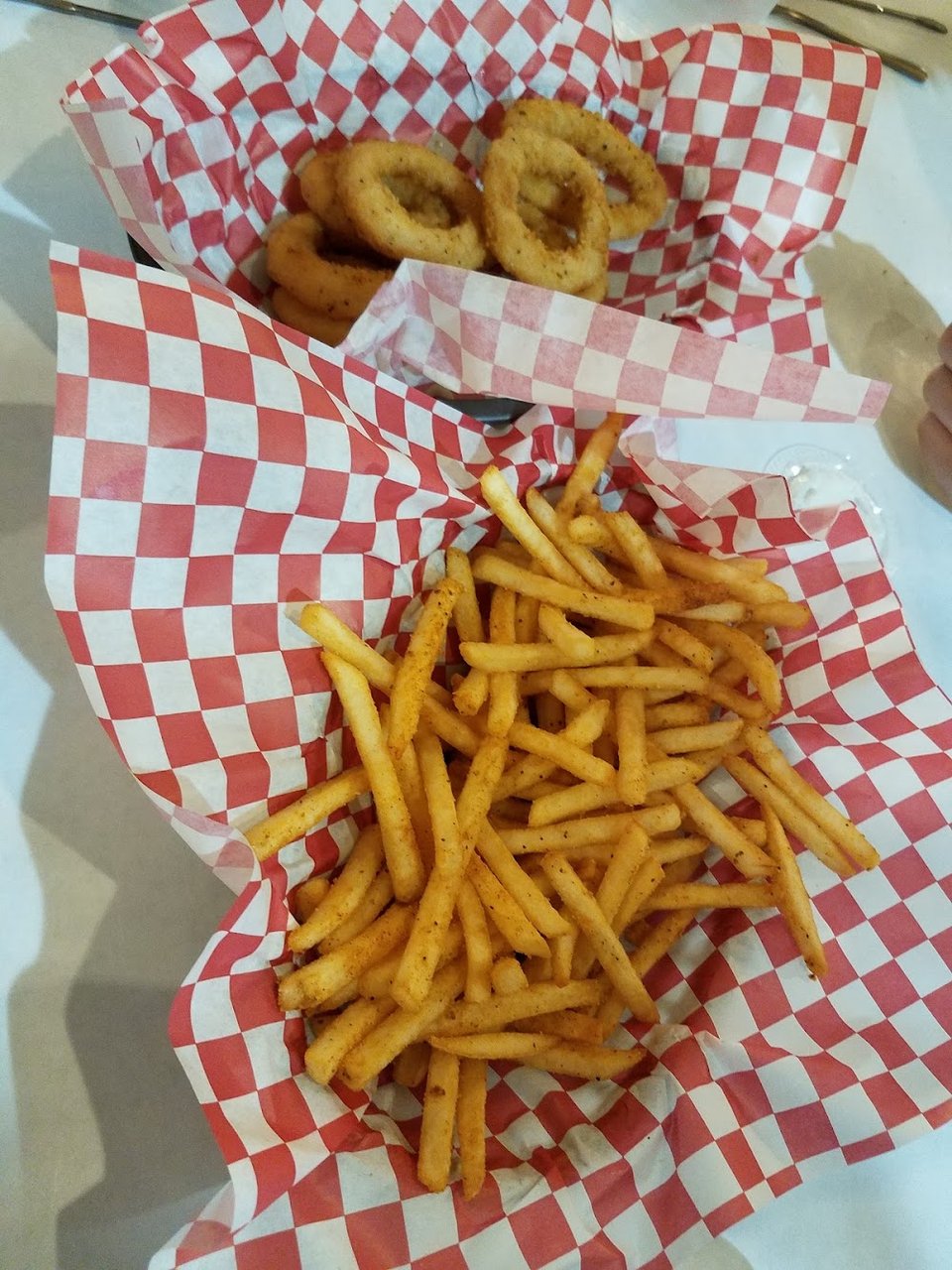 Printed menu with po-boys and fries