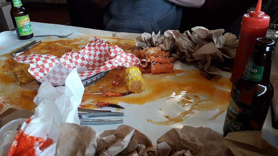 Close-up of seafood boil menu items